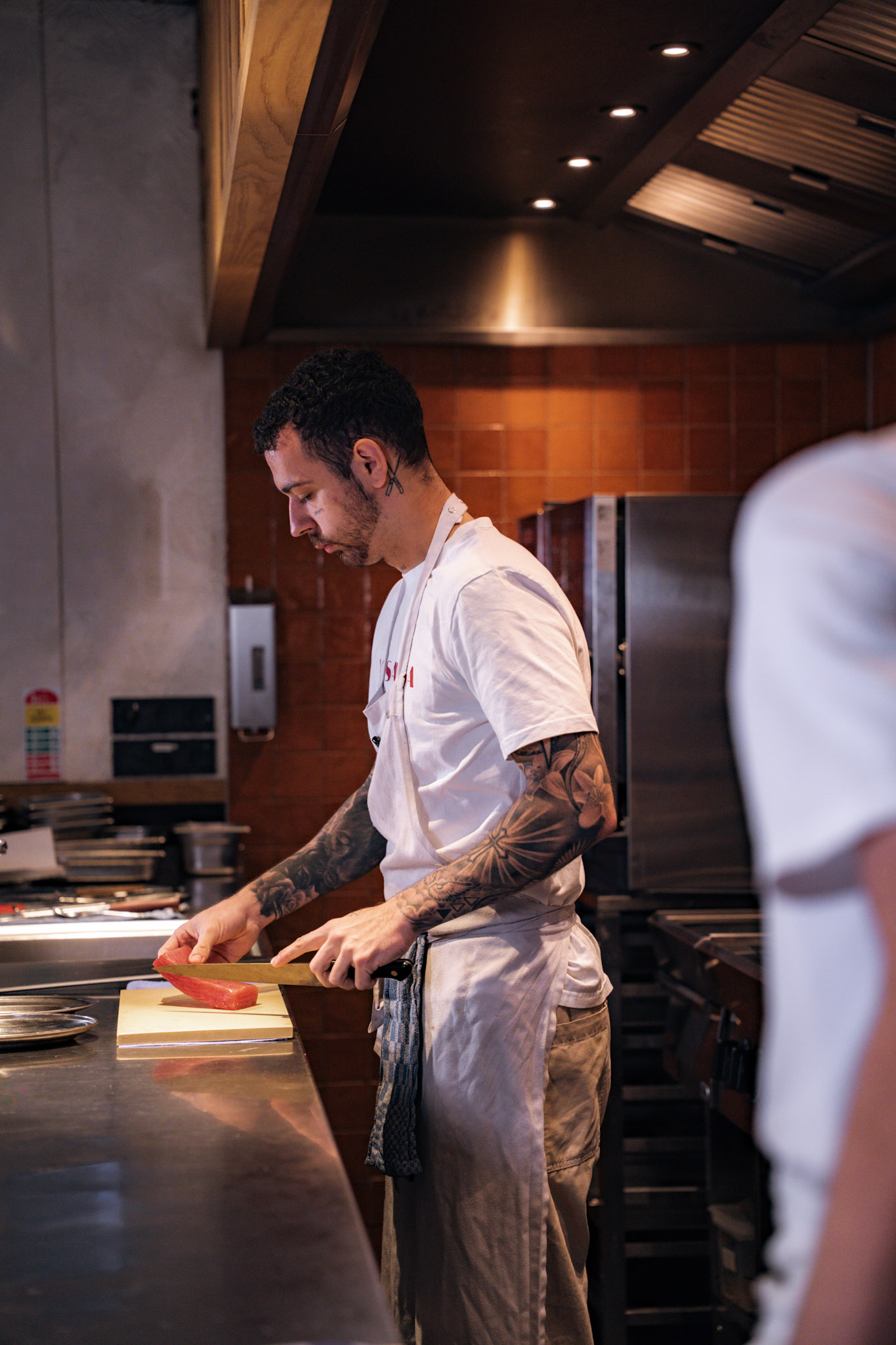 Daniel Castelló, founder of ChefCrew Recruitment, cooking in a professional kitchen